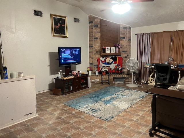 living room featuring visible vents, baseboards, ceiling fan, and vaulted ceiling