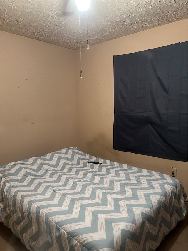 bedroom featuring a textured ceiling