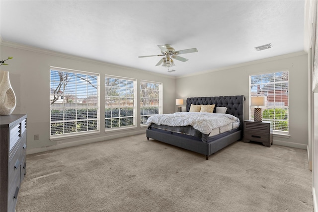 bedroom with light carpet, visible vents, and ornamental molding