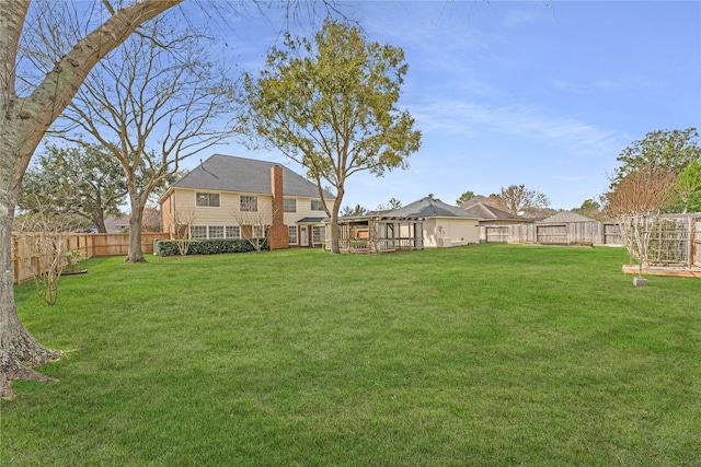 view of yard featuring a fenced backyard