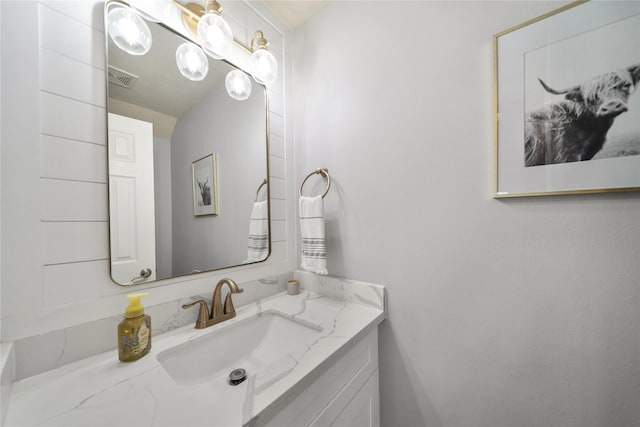 bathroom featuring vanity and visible vents