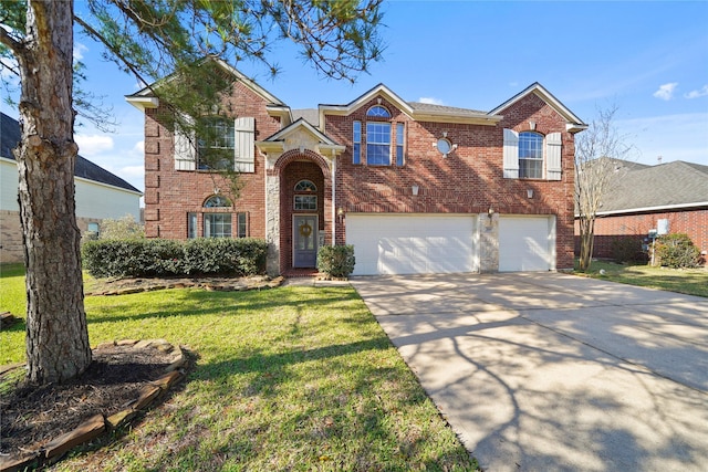 traditional home with a front lawn, a garage, brick siding, and driveway