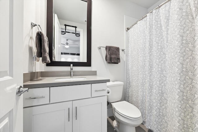 full bath featuring vanity and toilet