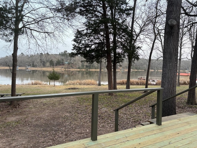 wooden terrace with a water view