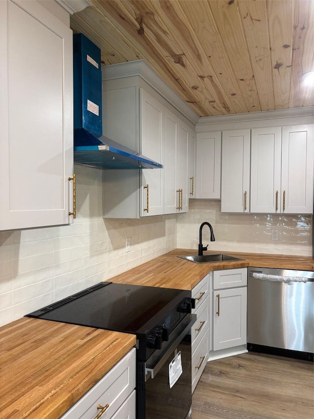 kitchen with stainless steel dishwasher, wall chimney range hood, wood ceiling, black / electric stove, and butcher block countertops