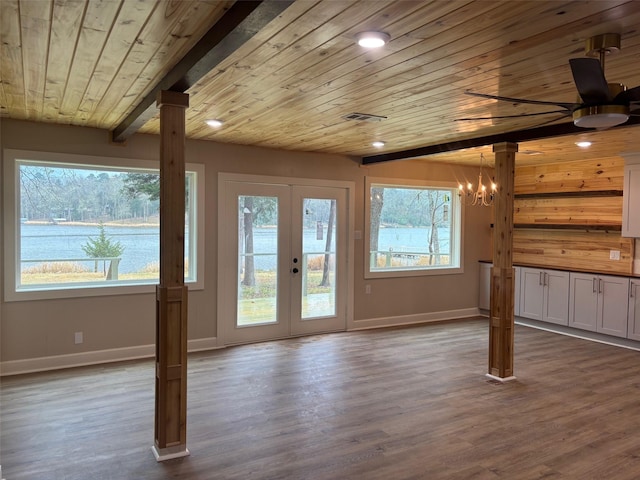 interior space featuring visible vents, dark wood-type flooring, french doors, wooden ceiling, and baseboards