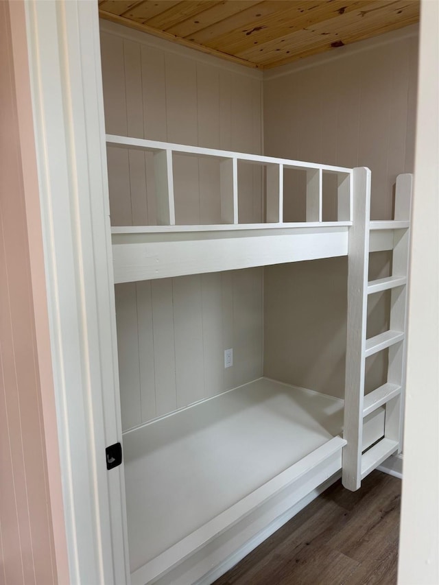 interior details featuring wood ceiling and wood finished floors