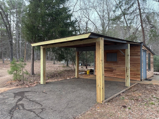 view of patio featuring an outbuilding