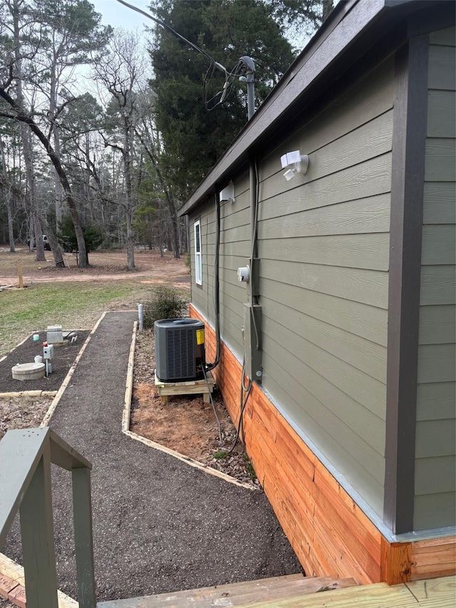 view of side of property with central AC unit