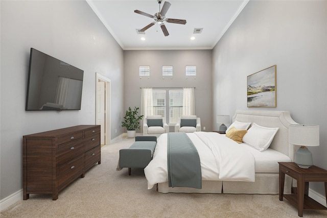 bedroom featuring visible vents, baseboards, light colored carpet, ornamental molding, and a towering ceiling