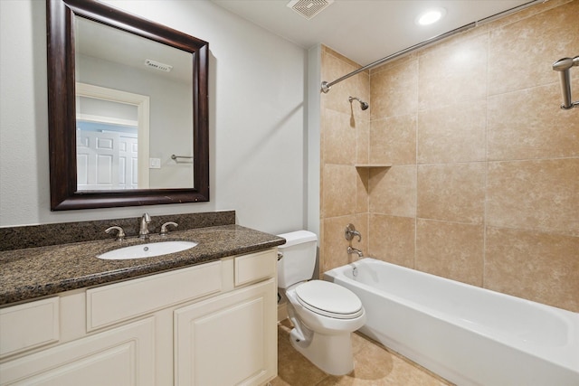 full bathroom with tile patterned floors, visible vents, toilet, and vanity