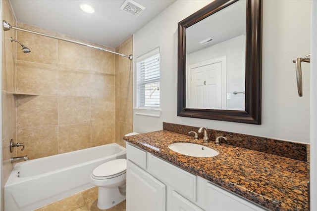 bathroom with visible vents, vanity, toilet, and bathing tub / shower combination