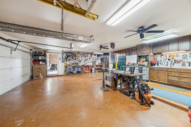 garage with a workshop area and a ceiling fan