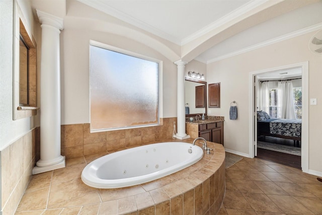 ensuite bathroom with decorative columns, ensuite bath, a whirlpool tub, and ornamental molding