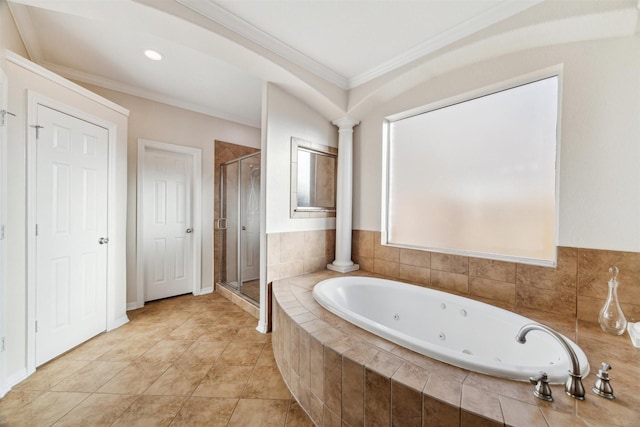 bathroom with tile patterned floors, a stall shower, a jetted tub, crown molding, and ornate columns