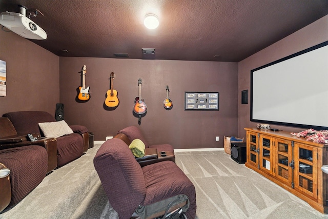 home theater featuring visible vents, baseboards, carpet, and a textured ceiling