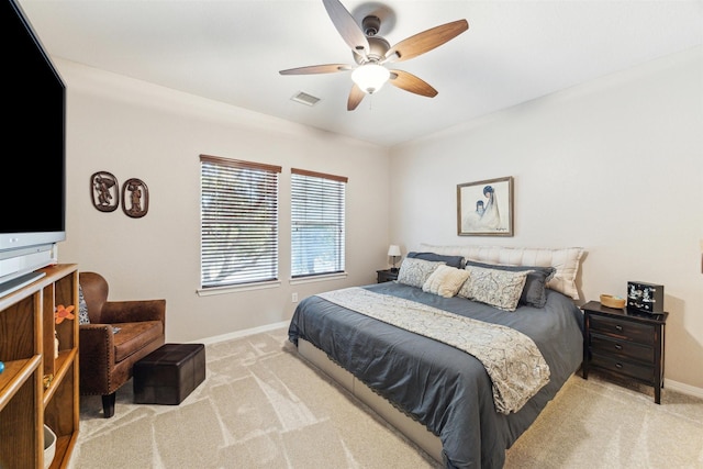 bedroom with baseboards, visible vents, carpet floors, and ceiling fan