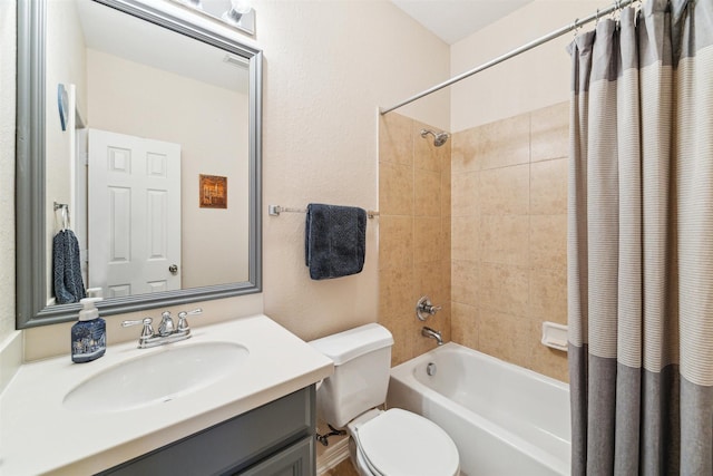 full bath with vanity, toilet, and shower / bath combo with shower curtain