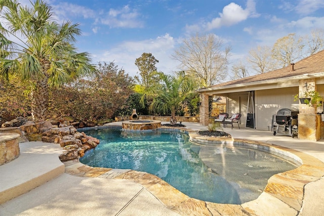 view of swimming pool featuring a patio, a grill, and a pool with connected hot tub