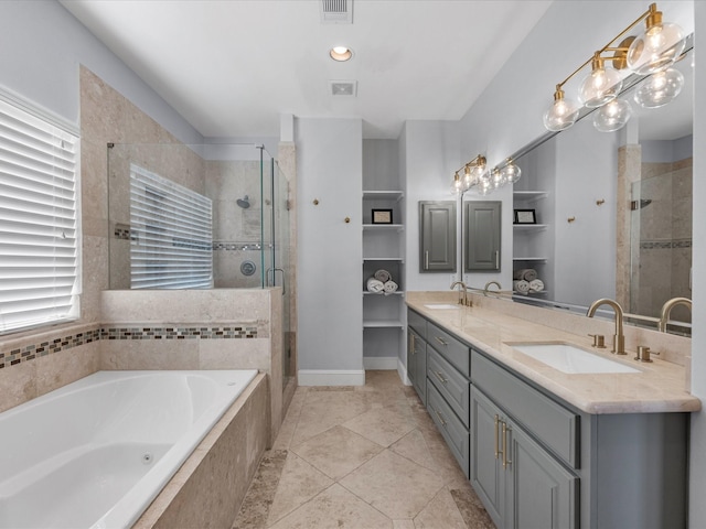 bathroom with a shower stall, a bath, visible vents, and a sink