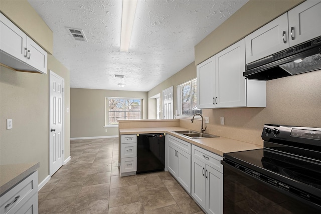 kitchen with black appliances, a sink, under cabinet range hood, white cabinetry, and light countertops