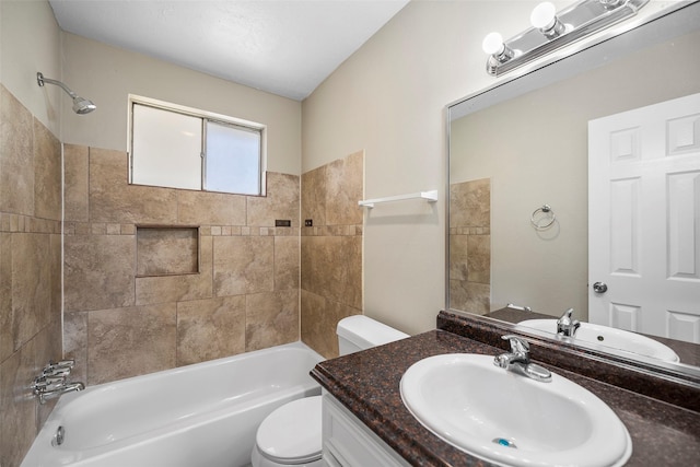 bathroom featuring vanity, toilet, and shower / tub combination