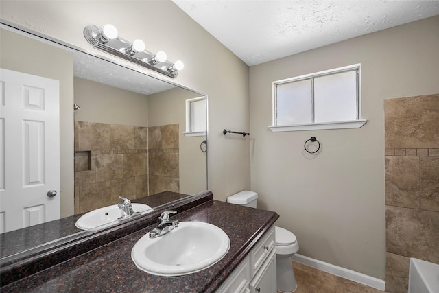 full bath featuring baseboards, toilet, walk in shower, and vanity