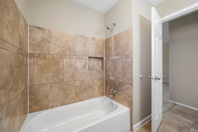 full bath with baseboards and bathing tub / shower combination