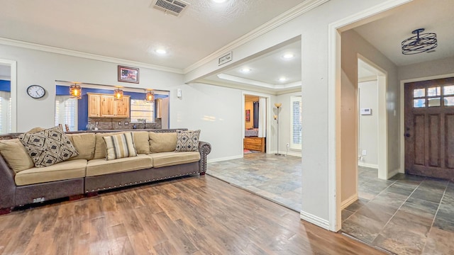 17866 Magnolia Ln, New Caney, TX 77357 - living area featuring baseboards, crown molding, recessed lighting, and wood finished floors