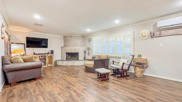 17866 Magnolia Ln, New Caney, TX 77357 - living room with ornamental molding, wood finished floors, a wall mounted AC, recessed lighting, and baseboards