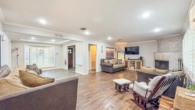 17866 Magnolia Ln, New Caney, TX 77357 - living area with crown molding, recessed lighting, wood finished floors, a fireplace, and baseboards