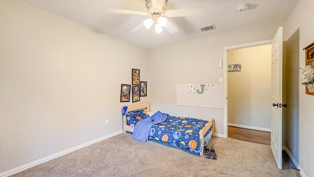 17866 Magnolia Ln, New Caney, TX 77357 - carpeted bedroom featuring baseboards and ceiling fan