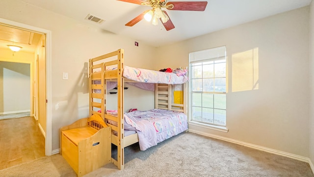 17866 Magnolia Ln, New Caney, TX 77357 - carpeted bedroom featuring attic access, baseboards, and a ceiling fan