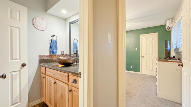 17866 Magnolia Ln, New Caney, TX 77357 - bathroom with an AC wall unit, vanity, and baseboards