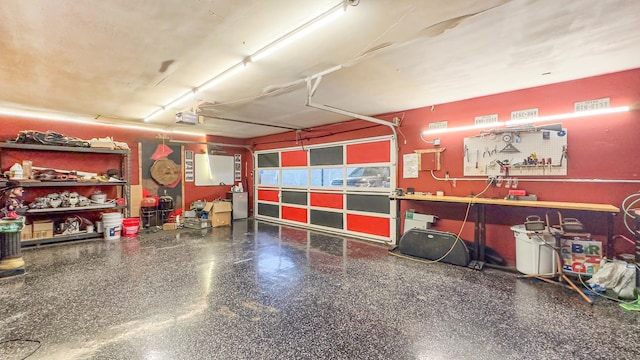 17866 Magnolia Ln, New Caney, TX 77357 - garage with a garage door opener and a workshop area
