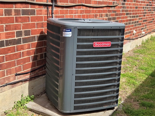 exterior details featuring brick siding and central air condition unit