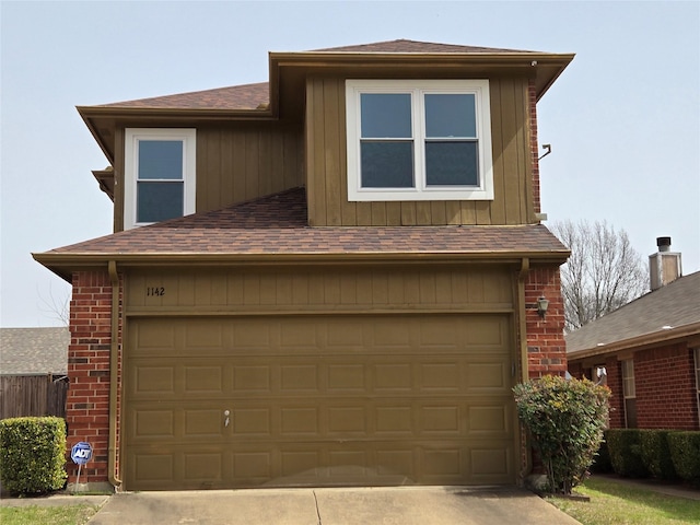 view of front of house with brick siding, concrete driveway, and roof with shingles