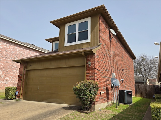 view of side of home featuring fence, an attached garage, central AC, concrete driveway, and brick siding