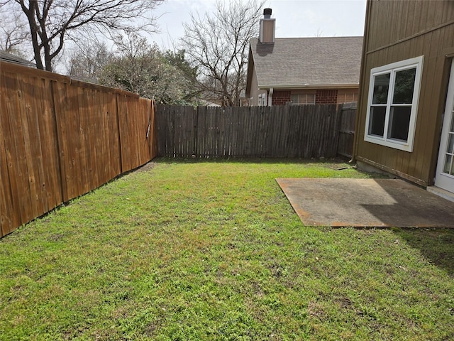 view of yard featuring a patio area and a fenced backyard