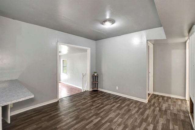 interior space featuring wood finished floors and baseboards