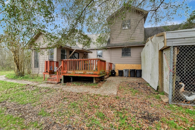 back of property with a deck