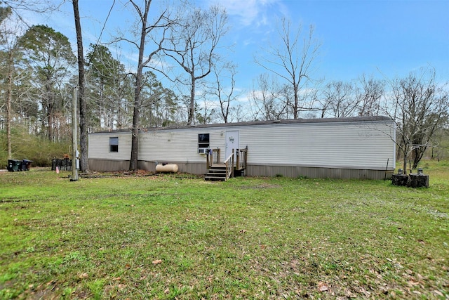 rear view of house with a yard