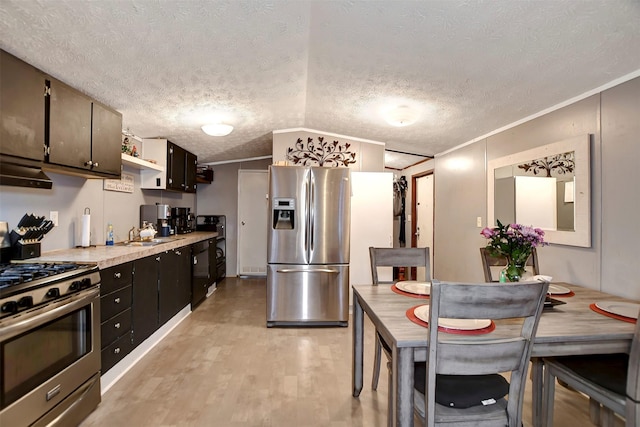 kitchen featuring stainless steel appliances, light wood-style flooring, crown molding, and light countertops