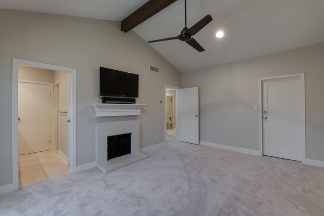 unfurnished living room featuring visible vents, beam ceiling, carpet, a fireplace, and ceiling fan