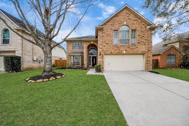 traditional-style home featuring a garage, a front yard, concrete driveway, and brick siding