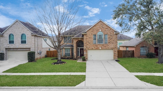 traditional home with brick siding, an attached garage, driveway, and fence