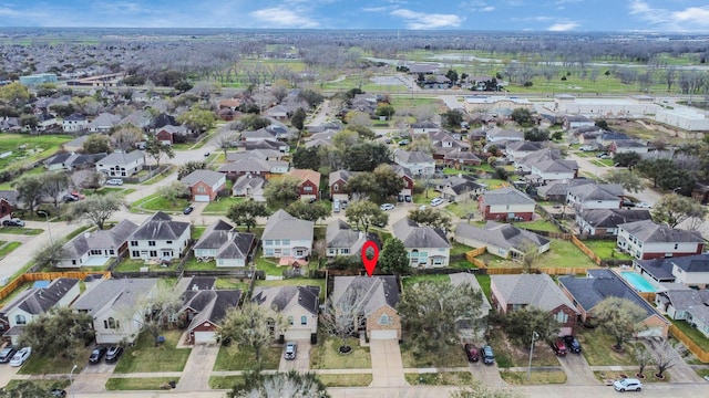 birds eye view of property with a residential view