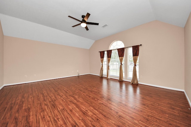 unfurnished room with lofted ceiling, wood finished floors, visible vents, and ceiling fan