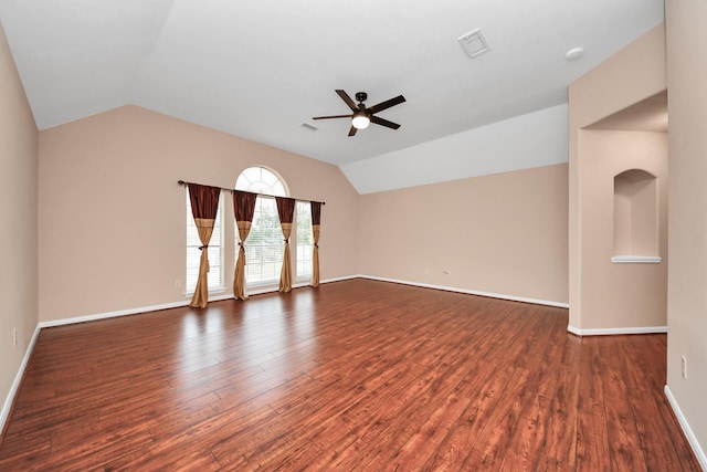 unfurnished room featuring lofted ceiling, wood finished floors, visible vents, and ceiling fan