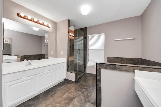 bathroom featuring a shower stall and vanity